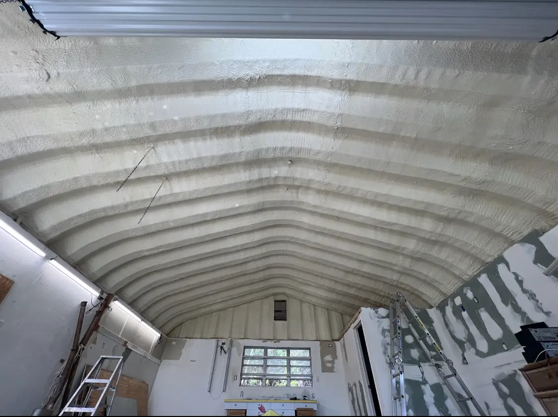 Spray polyurethane foam applied to the underside of a metal roof deck in Bostonia